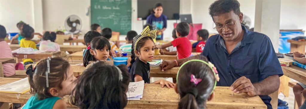 Group of kids listening to a teacher