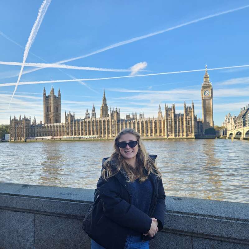 A woman posing in front of Big Ben